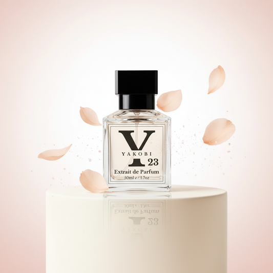 Yakobi 23 perfume bottle with rose petals on a soft pink background